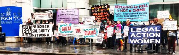 Protesters outside the Royal College of Psychiatrists' head office.  Banners include: Prisoner Solidarity Network, All African Women's Group, Break the Chains, Women of Colour Global Women's Strike, Refusing to Kill is Not a Crime, Legal Action for Women.